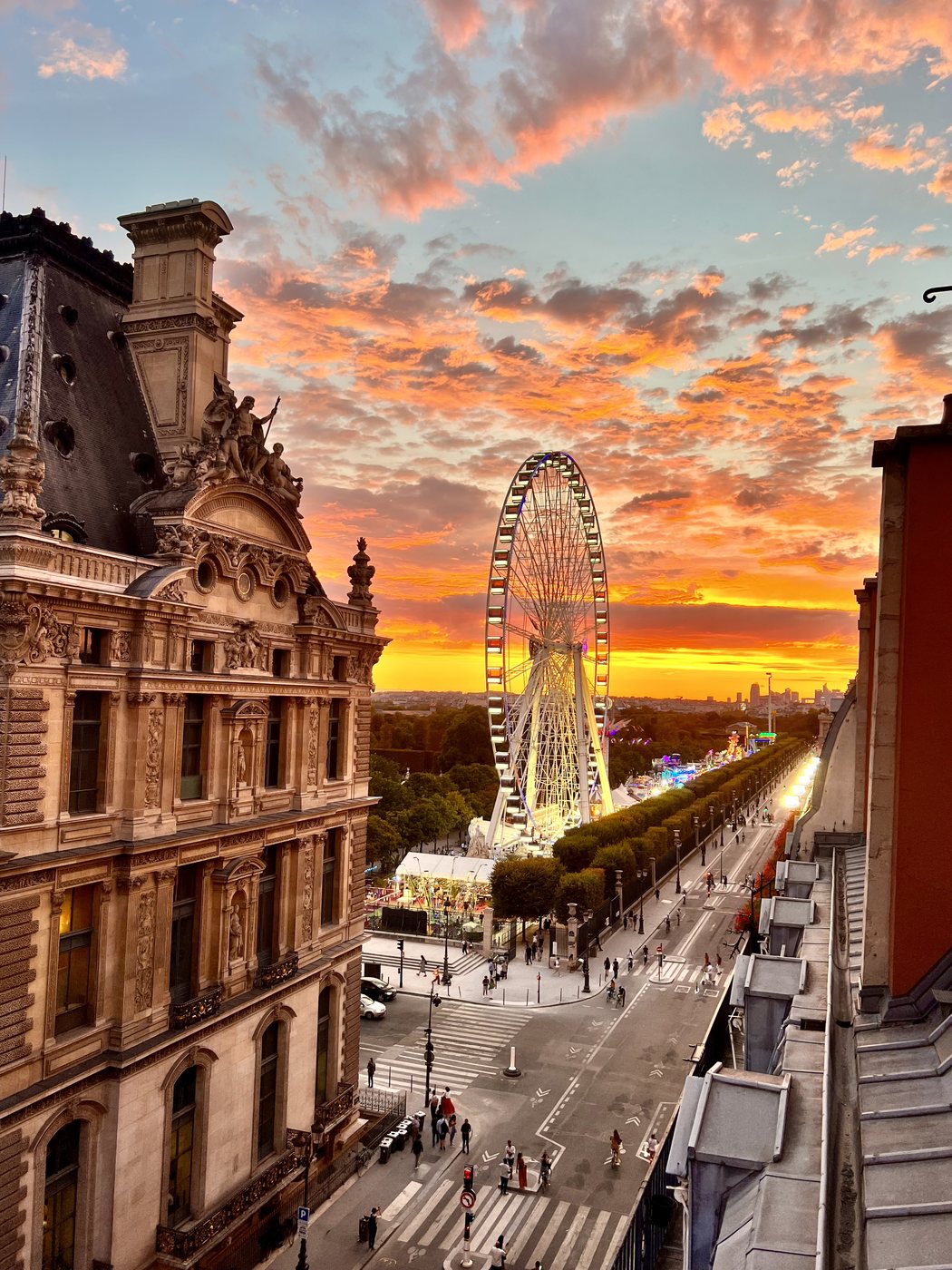 The Louvre palace at sunset from the Seine in Paris